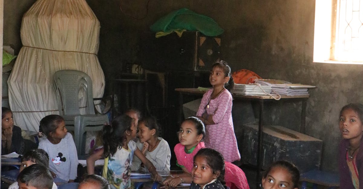 A group of children attentively learning in a rural classroom in Banaskantha, India.